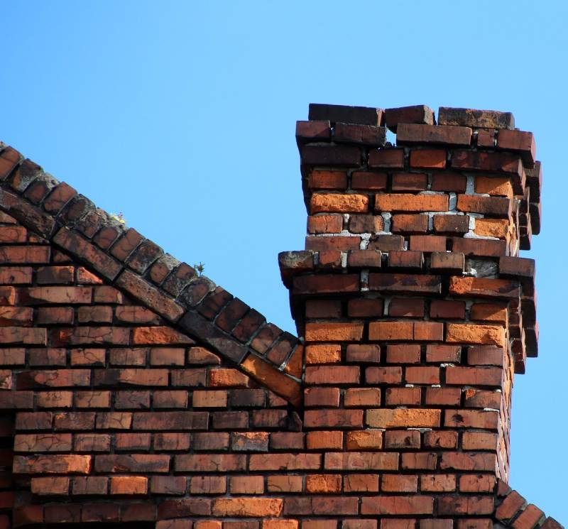Signs Your Rockville Home Needs a Chimney Inspection Damaged chimney on an Rockville home showing cracks and missing mortar